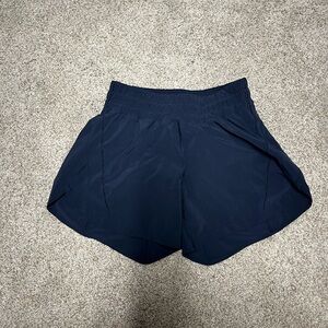 Women’s Lululemon track that short 5 inches in navy.